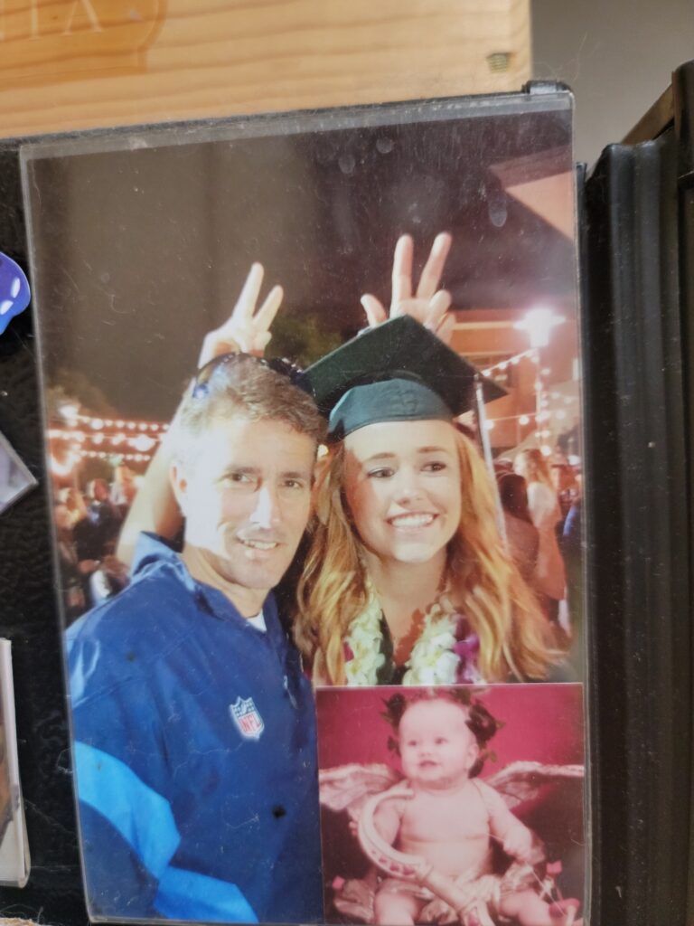Framed graduation portrait with baby photo below