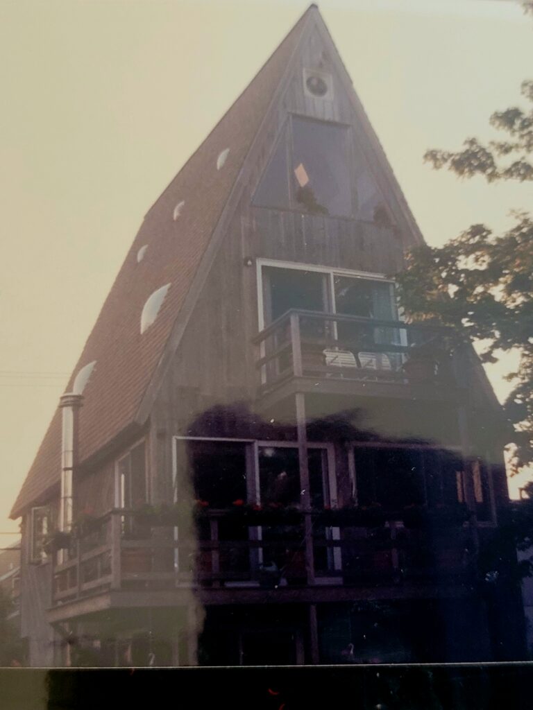 A-frame wooden house with balconies