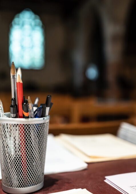 Pencil and pen holder on documents