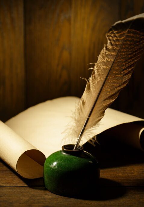 Vintage quill and ink with parchment scrolls
